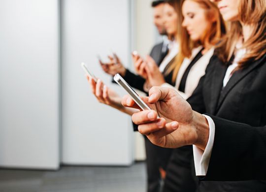 Close up of businessman using smartphone. Business concept